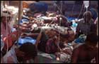 Wounded civilians in makeshift hospital at Mu'l'li-vaaykkaal