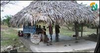 A 'community center' in Gnani madam, an impoverished village along A32. A water tank here holds water for village residents.