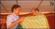 Popular Sinhala singer Jayatileka Bandara is being honoured by K.V.Balakumar