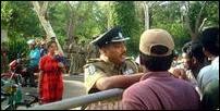 Police officer is seen engaged in a conversation with the students