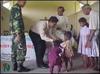 Mr.Muthuradhakrishnan distributing milk while Principal Mr.Sountharajah, SEDOT official Mr.Shanmuganathan are seen