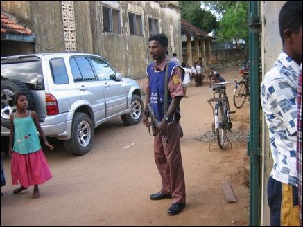 A little girl looks at a Police Relief Service in Methodist Central College welfare camp.