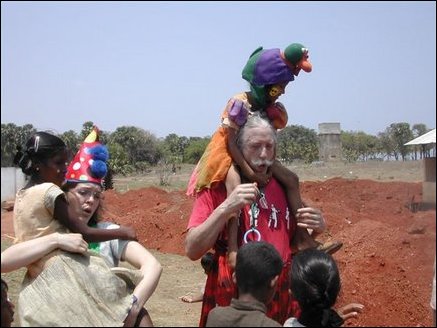 Dr. Patch Admas carrying nine years old Arutchchelvi Manoharan of Alas Garden welfare camp in Uppuveli in Trincomalee district.