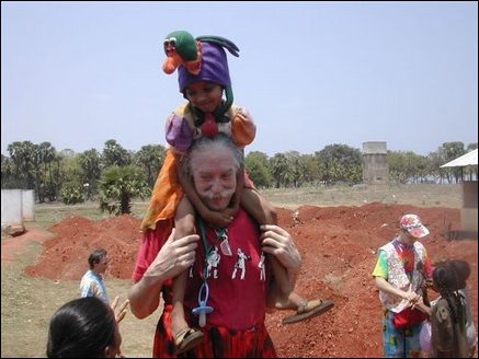 Dr. Patch Admas carrying nine years old Arutchchelvi Manoharan of Alas Garden welfare camp in Uppuveli in Trincomalee district.