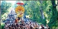 Lord Konesar with his consort Maathumai Ambal being taken from temple to the holy well Papanasachunai which is surrounded by barracks of the SLA Gajaba regiment