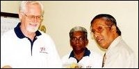 Dr.Gerhard H.B.Huck, GTZ-BESP acting Programme Co-ordinator hands over counselling materials to Mr.Thiayakalingam, NE Provincial Education Ministry Secretary at the event held at ministry auditorium. Mr.Sundaram Divakalala, Director of BECARe of GTZ is seen in middle.