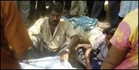 Dead boy of the civilian, Mr Koneswaran Muthaiah, is being covered by a piece of cloth