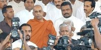 Mr.Wimal Weerawnase, parliamentary group leader of the Janatha Vimukthi Peramuna (JVP), Mr. H.L.de Silva, Presidential Councilor, Mr.Nandana Gunathilaka, JVP politburo member, Rev Ellay Gunwansa thera and JVP parliamentarians out side the court house, 15 July 2005.