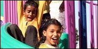 These two happy young residents of Trincomalee are among thousands of children in the region who will benefit from the new play park. Photo: USAID/Claire McConnachie