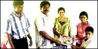 Ms Vipra Seneviratne and Mr.Elilan seen distributing textbooks for Year Five students.