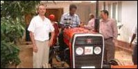 GTZ Principal Advisor Mr. Wolfgang Garatwa (left) in handing over the new Tractor.