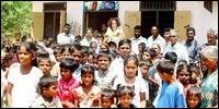 Deva Nagar residents with Swami at the end of the opening ceremony