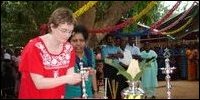 Norway representative Ms. Mildrid Mikkelsen lighting traditional lamp.
