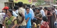 Civilians stand in a queue waiting for a passenger ship in northern Jaffna, Sri Lanka, Friday, Sept. 8, 2006. (AP Photo)
