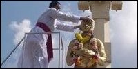 Father Jebanesan garlanding SJV Chelvanayagam's statue