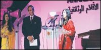 Sabiha Sumar speaking after receiving award from Journalist Riz Khan and Indian actress Madhuri Dixit (Photo: dawn.com)