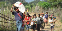 Refugees fleeing from Burma to Thailand in on 28 November, 2010 [Photo courtesy: The Irrawaddy]
