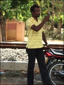 SL Mil Intelligence operative taking photo